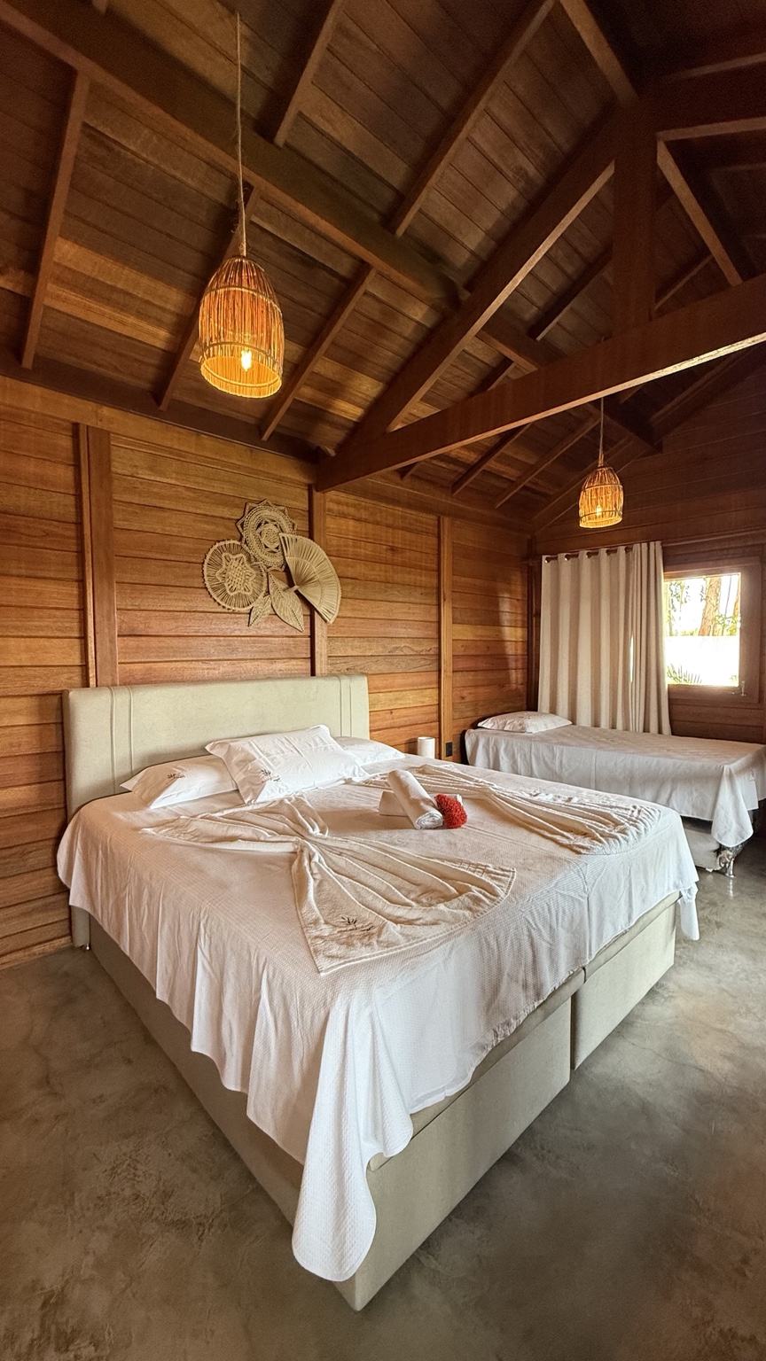 Warm wooden bedroom interior at Eucalyptus Villas